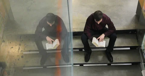 Student reading a book in the library. Concept: educational, portrait, library Stock Footage 86218073