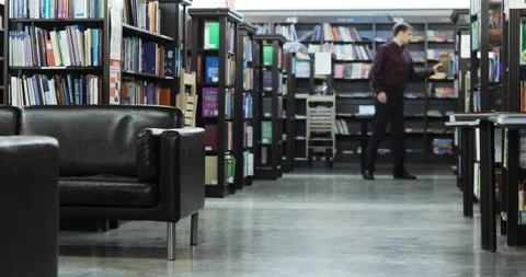 Student reading a book in the library. education concept Stock Footage 86208370