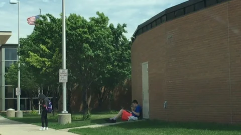 Student Reading Book Outside of School 스톡 동영상 90399207