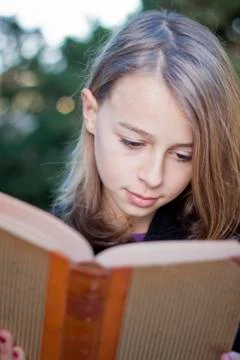 Student reading a book Stock Photos