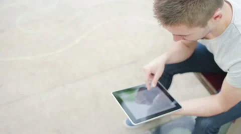 Student reading on electronic device Stock Footage 39343223