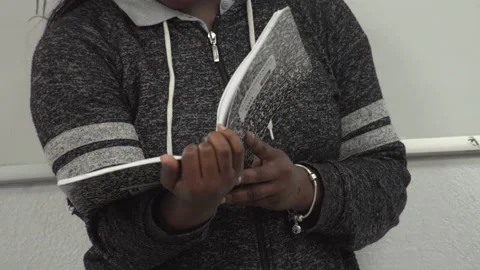 Student reading notebook Stock Footage 186880924