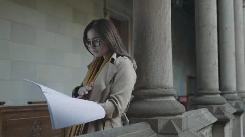 Student reading notes in notebook at college. Businesswoman looking in workbook Stock Photos