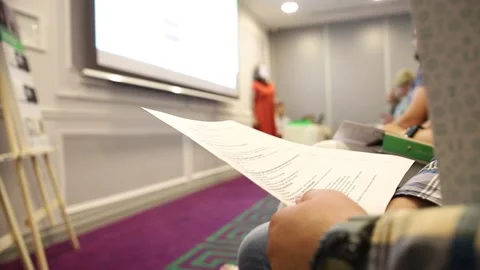 Student reading program during conference presentation Stock Footage 324865300