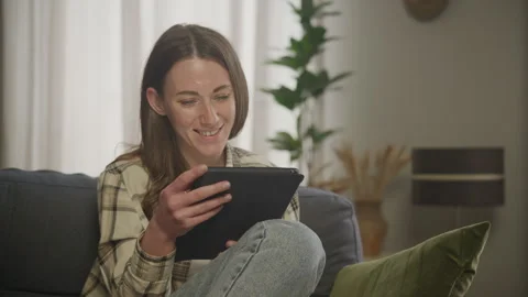 Student Reading Tablet in Apartment Stock Footage 278681355