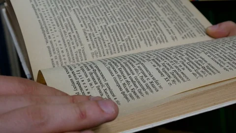 Student reads a book in the library Stock Footage 86565880