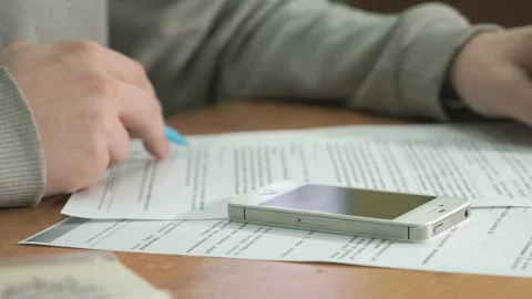 Student reads document text on paper. Close-up Vídeo Stock 87768070