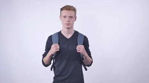 Student remove the backpack on a white background Stock Footage 70566830