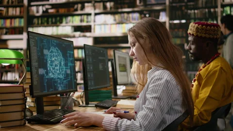 Student research AI brain visuals on desktop computer while reading books Stock Footage 337228928