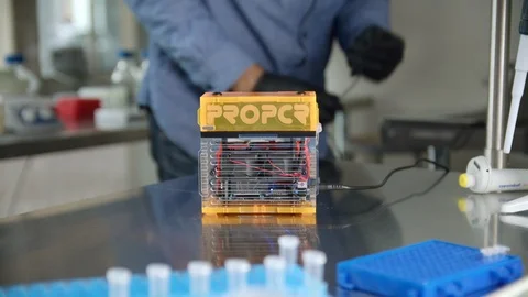 Student researcher unplugging pro pcr box to the power Stock Footage 112158902