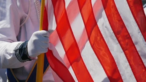 Student of the sailors academy standing with big American flag outdoors in the Stock Footage 111155949