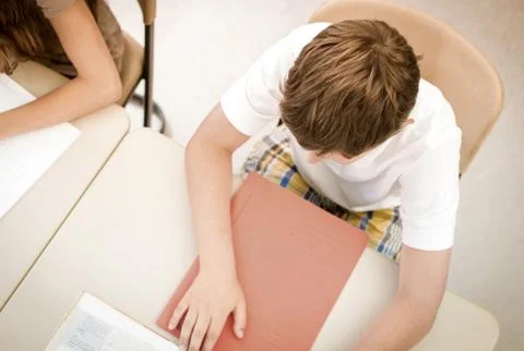 Student in school class learning or writing test Stock Photos