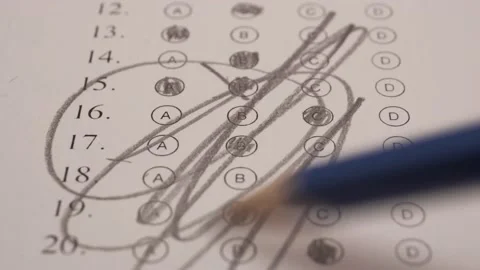 Student Scribbling Multiple Choice Test Bubble Sheet With Pencil. - close Stock Footage 179537628