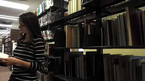 Student searching for books Stock Footage 46947775