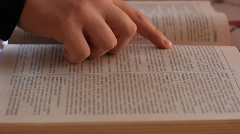 Student searching word in dictionary. Stock Footage 37343072