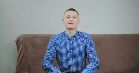 Student shakes hands sitting at computer in room Stock Footage 146567501