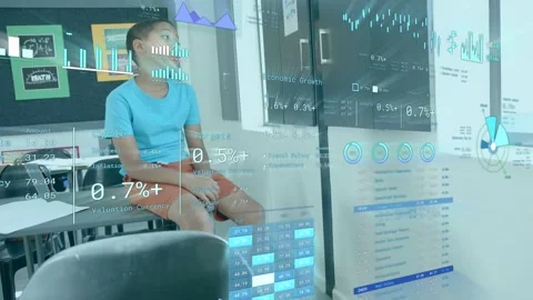 Student shifting gaze right and upward in classroom as HUD charts updating with Stock Footage 334321976