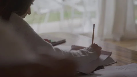 Student Sits On Floor Doing Homework Stock Footage 270331069