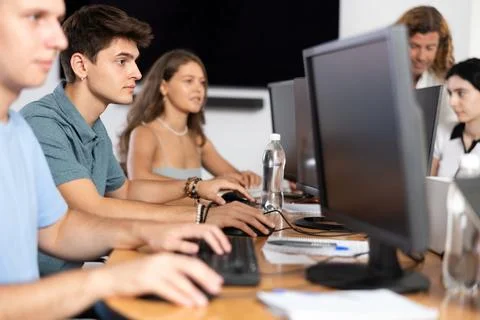 Student sits near computer Stock Photos