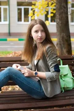Student sitting on bench Stock Photos
