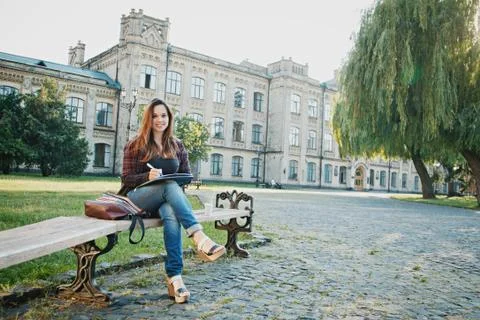 The student is sitting on the bench Stock Photos