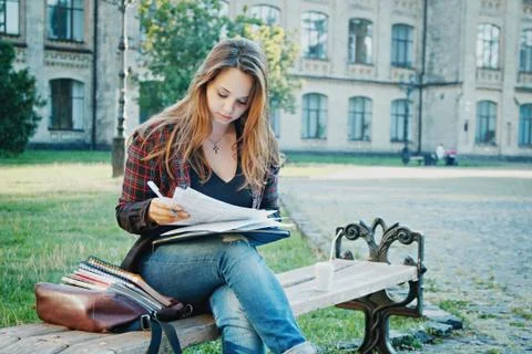 The student is sitting on the bench Stock Photos