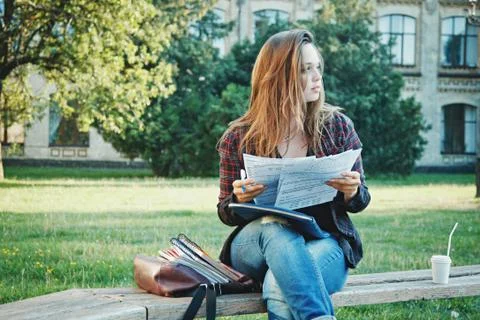 The student is sitting on the bench Stock Photos