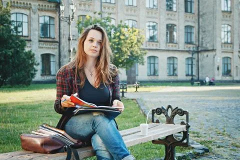 The student is sitting on the bench Stock Photos