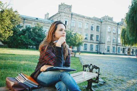 The student is sitting on the bench Stock Photos