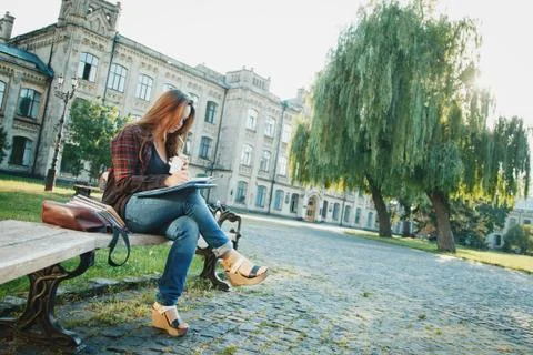 The student is sitting on the bench Stock Photos