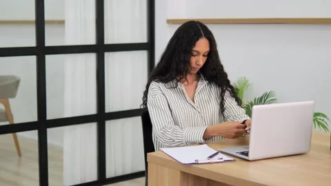 Student sitting at computer table typing on keyboard doing homework university Stock Footage 276998740