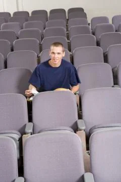 Student Sitting In Empty Classroom Foto stock