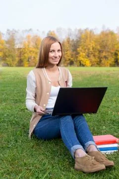 Student sitting on the grass Stock Photos