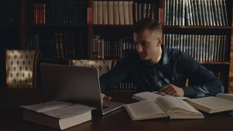 A student is sitting at the laptop Stock Footage 85246199