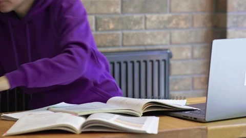 Student sitting learning and suddenly standing up from table and leave. Standing Stock Footage 279565855
