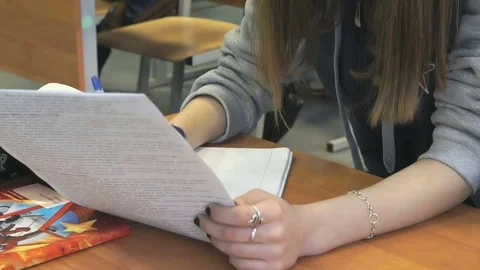 Student sitting at the school desk on the lesson Stock Footage 71605634