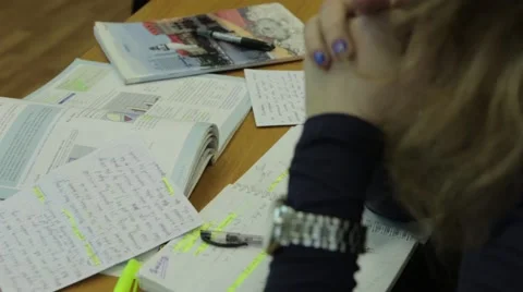 Student sitting at table with books and notebooks, Close-up HD Stock-Footage 44766106