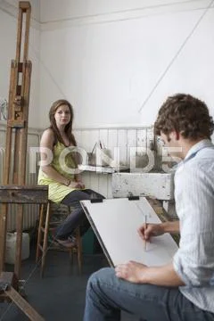 Student Sketching Model In Art Class Stock Photos