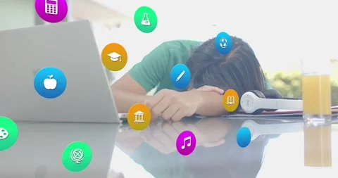 Student slumping over laptop sparking animated education icons swirling across Stock Footage 316965639