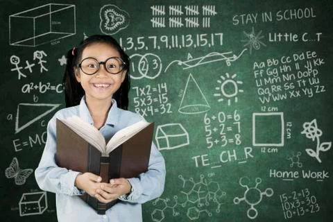 Student smiling with scribble on chalkboard Stock Photos