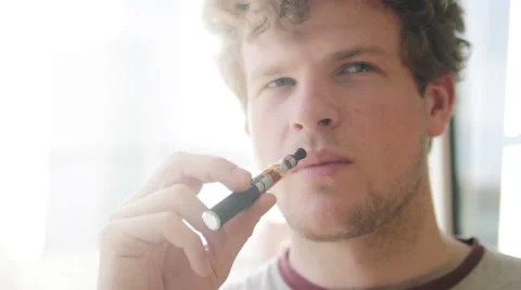 Student smoking e-cigarette Stock Footage 40622894