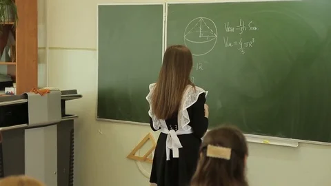 The student solves equations  on the blackboard Stock Footage 72197413