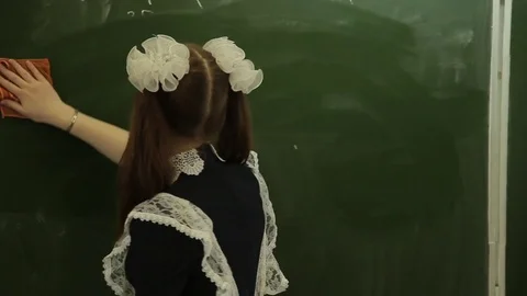 The student solves equations  on the blackboard Stock Footage 72197414