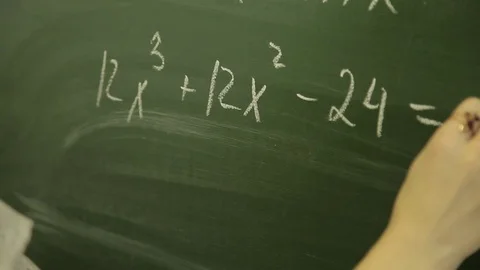 The student solves equations  on the blackboard Stock Footage 72197456