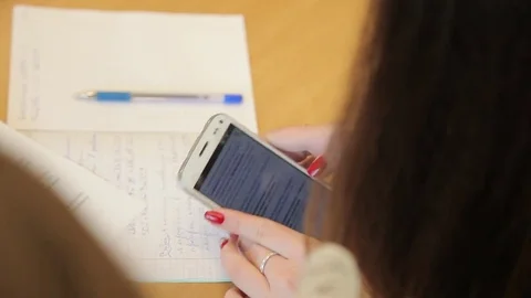 The student solves equations  in the notebook Stock Footage 72196941