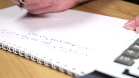 Student solving a difficult equation Video stock 329685553