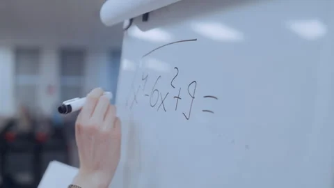 Student solving math equation on whiteboard Stock Footage 335127131