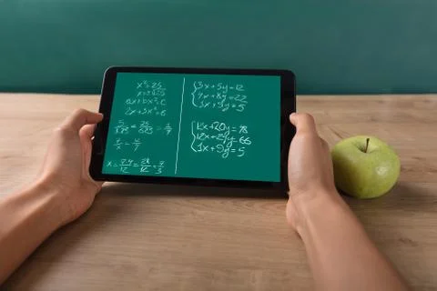 Student Solving Math Problem On Digital Tablet Stock Photos