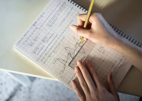 Student solving math problem student solving math problem Copyright: xZoon... Stock Photos