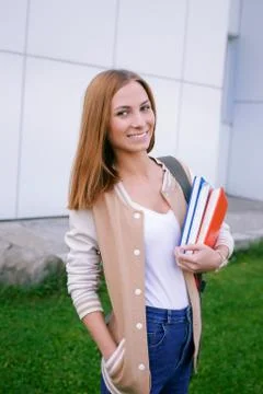 Student standing and smiling at camera Stock Photos